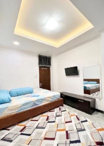 Bedroom 2 with king-size bed and TV