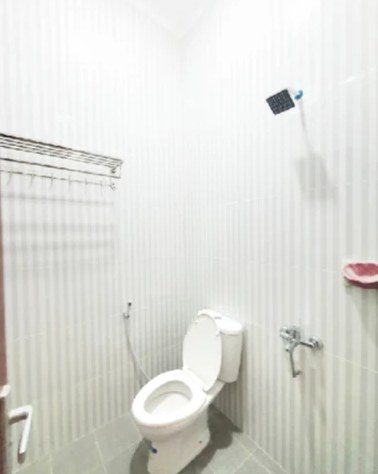 Private bathroom with water heater