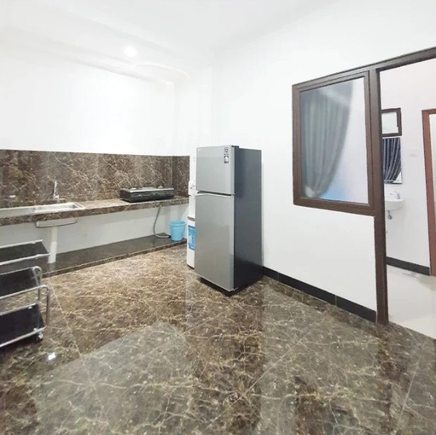 Shared kitchen with stove, sink and refrigerator